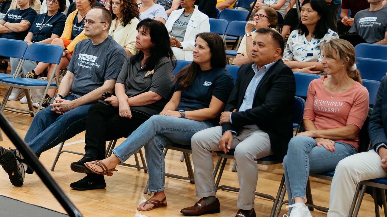 Five of the 2024 Center for Excellence awardees sit in the front row at convocation