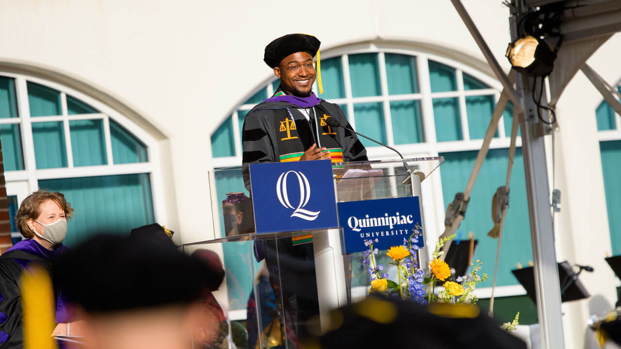 George Morgan Jr. speaks at podium on the library steps