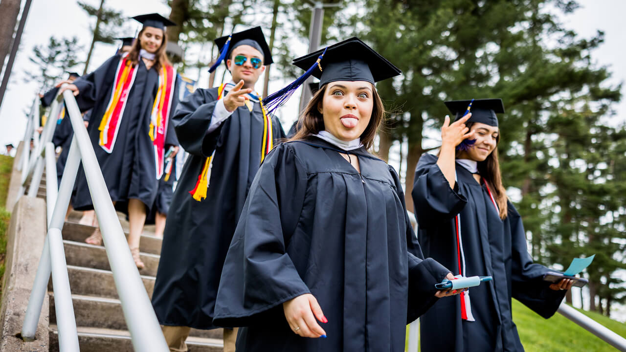 Graduate sticks out her tongue for a silly photo