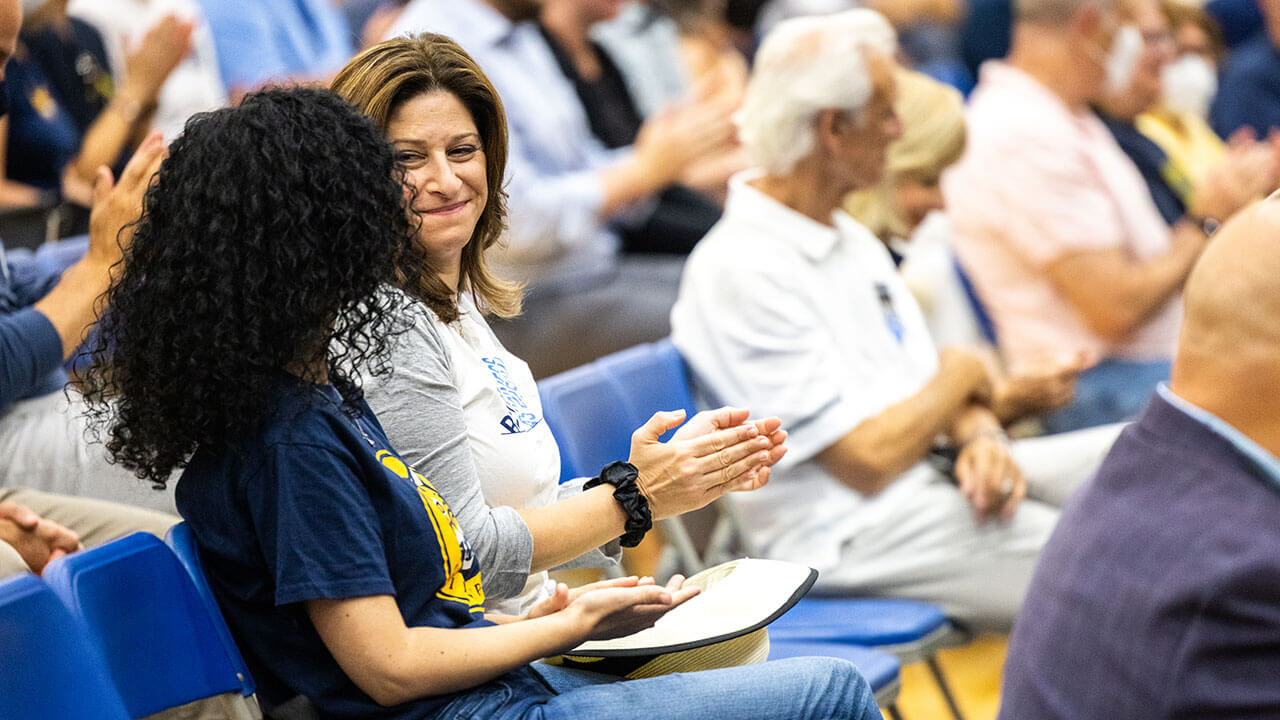 Holly Raider chats with faculty and staff members