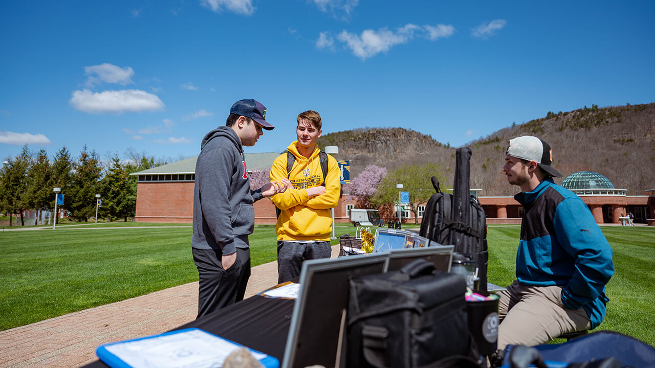 Students speak on the Quad.