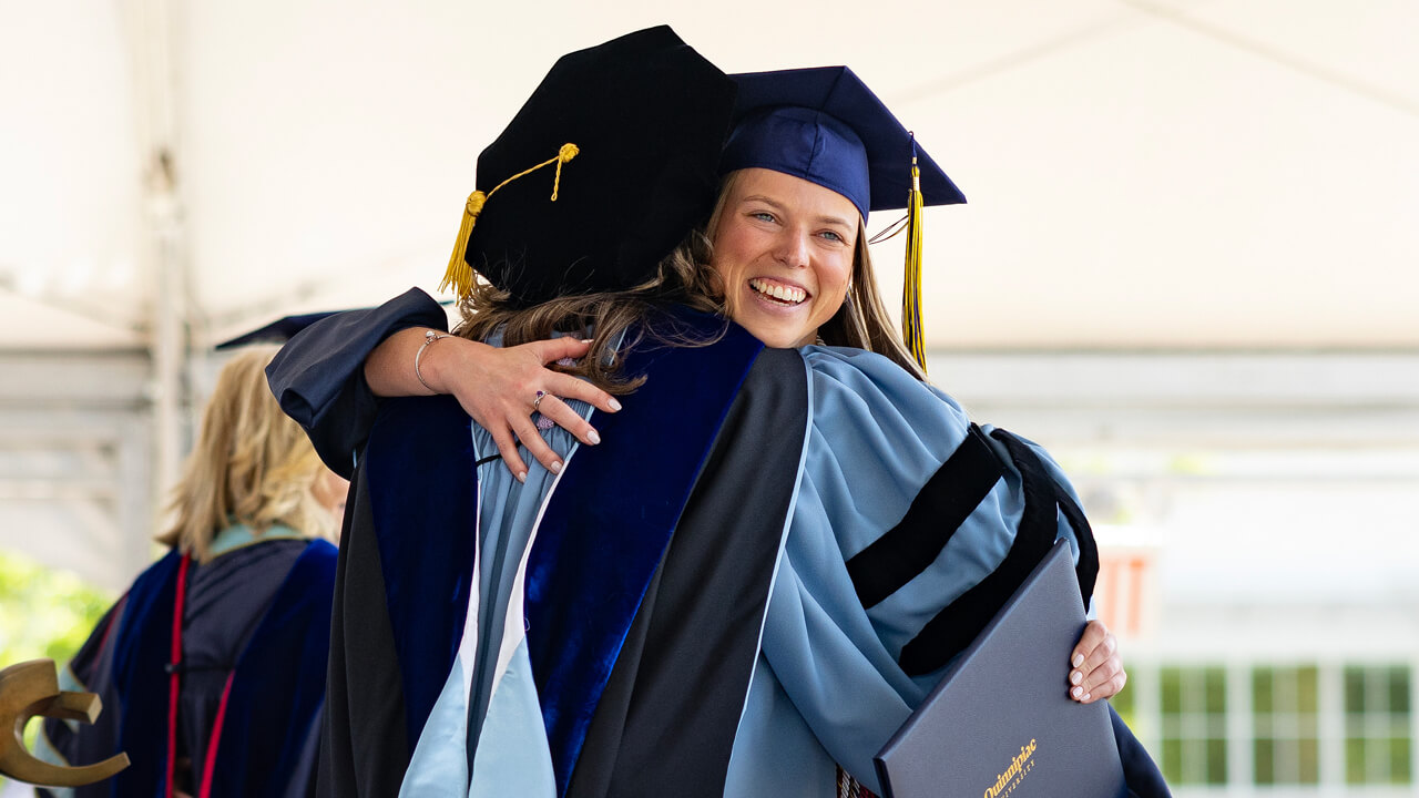 Student hugs professor