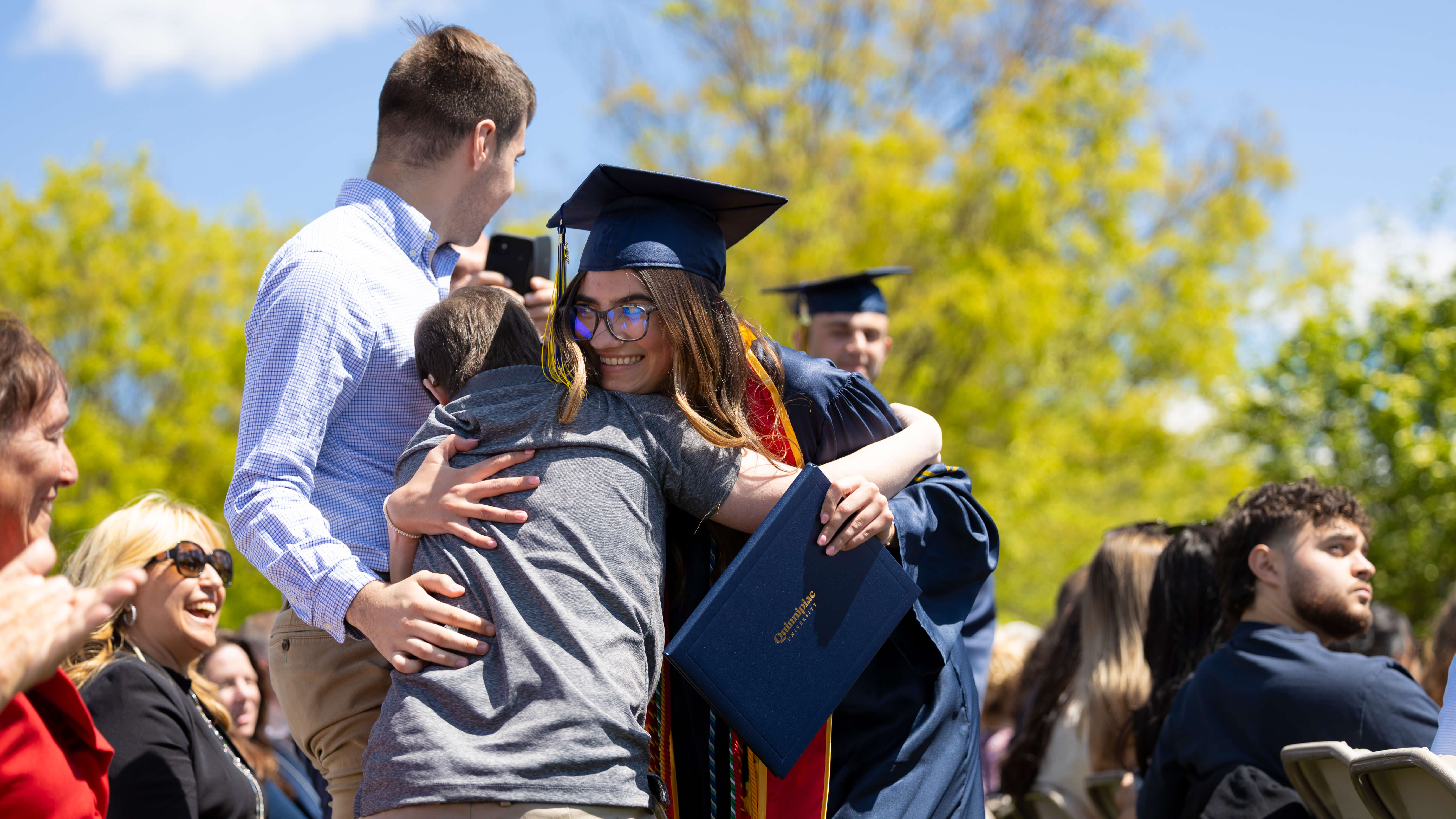 Student and young child hug