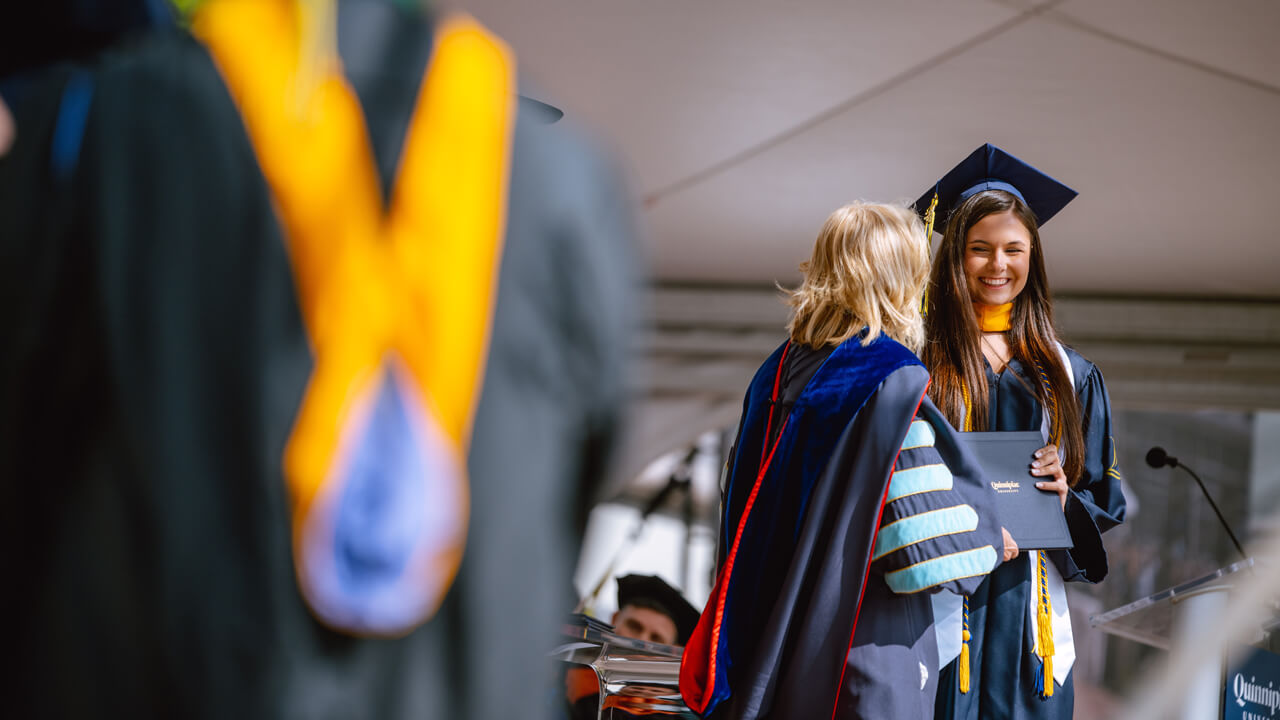 Student greets President Judy Olian