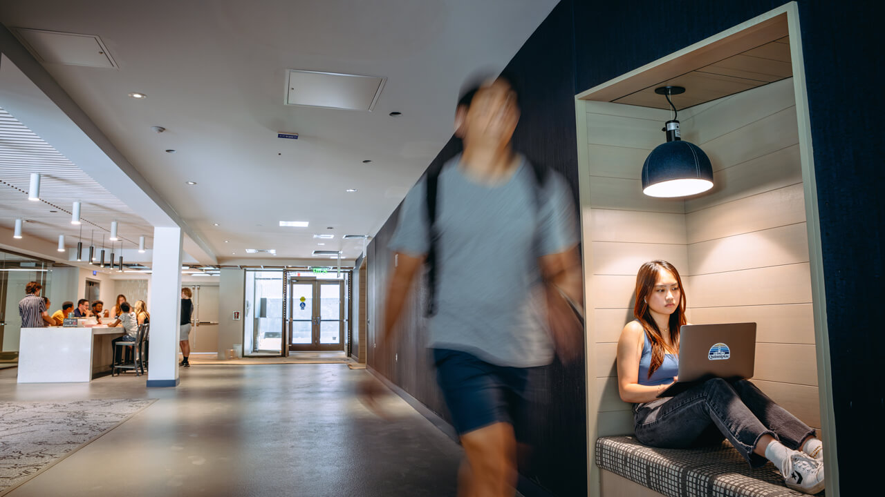 Student walks through common area