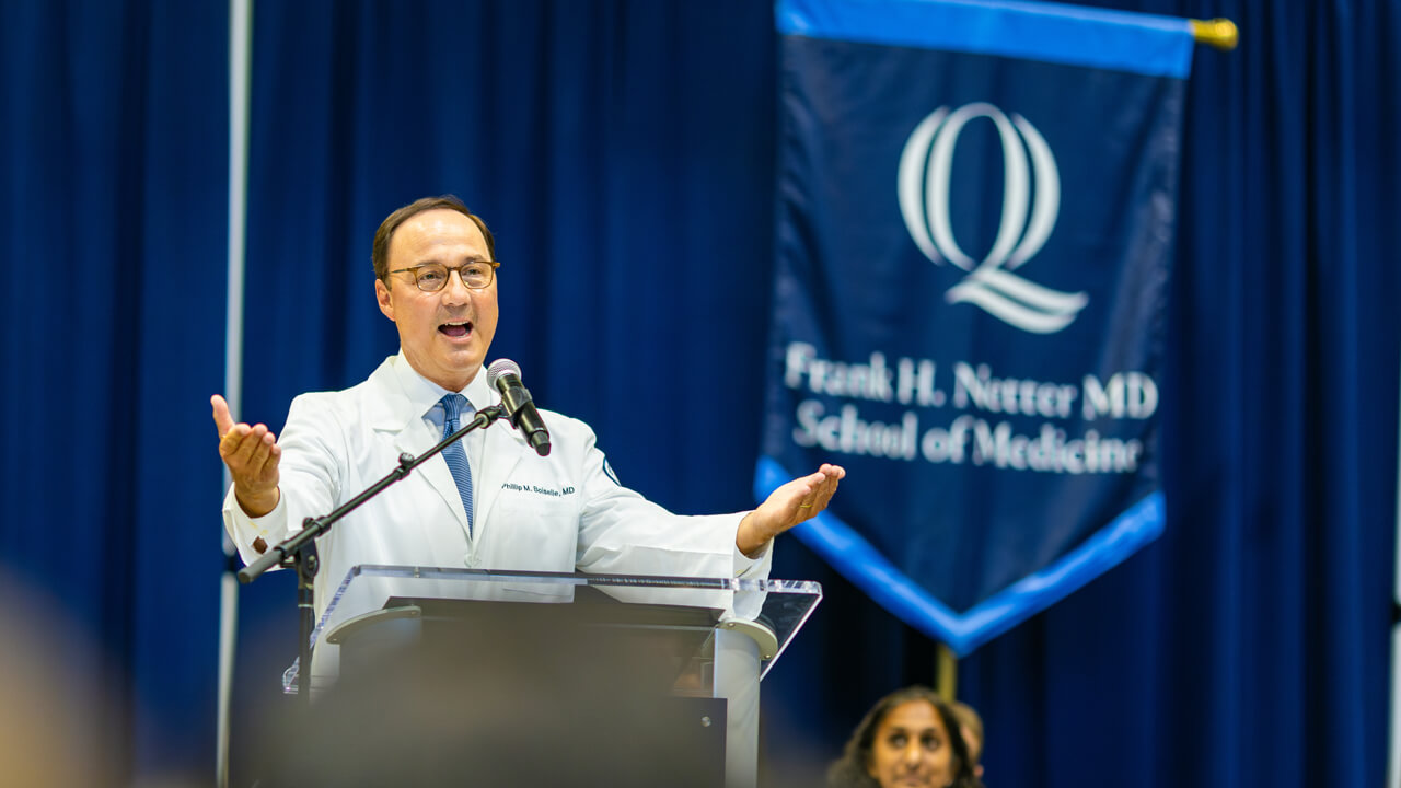 Person speaking at the podium