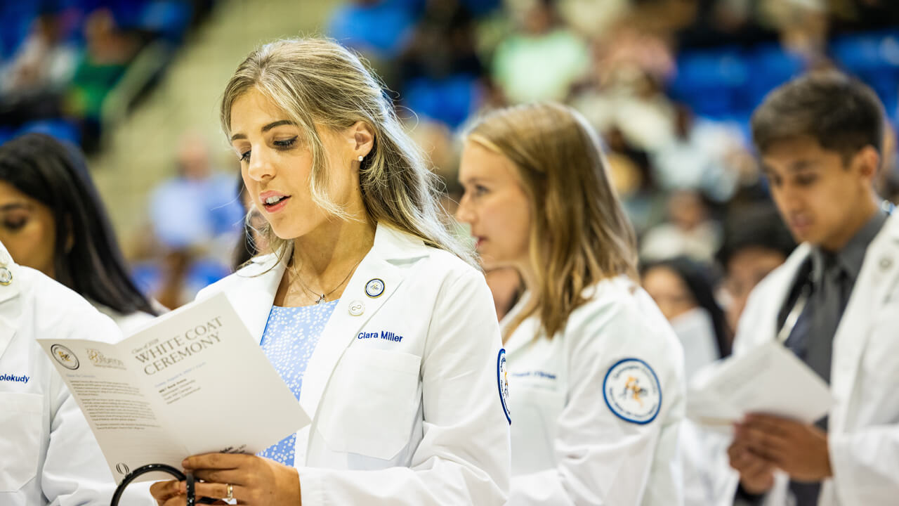 Students read from pamphlet