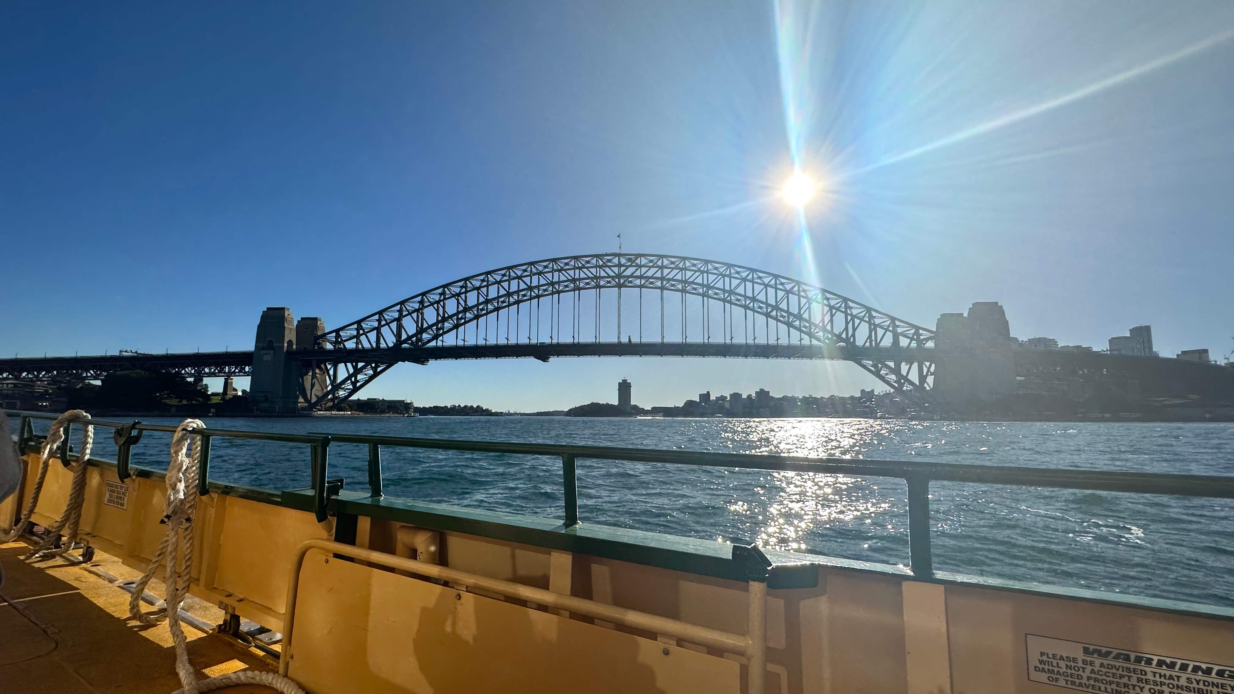 Sunny view of long arch bridge with water underneath