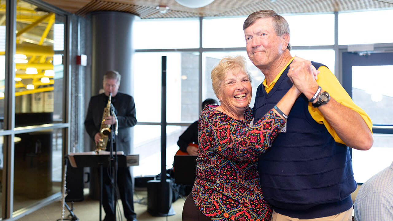 Alumni dancing to music together at the Alumni Heritage Luncheon