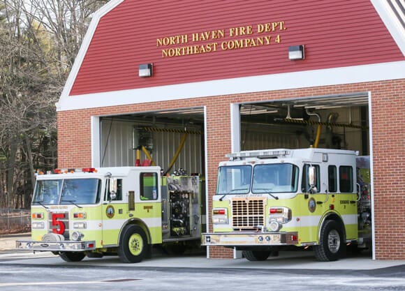 Two fire trucks parked outside North Haven fire station northeast company no. 4