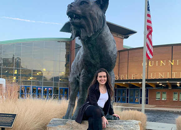 Gabriela Alvares on the Bobcat statue.