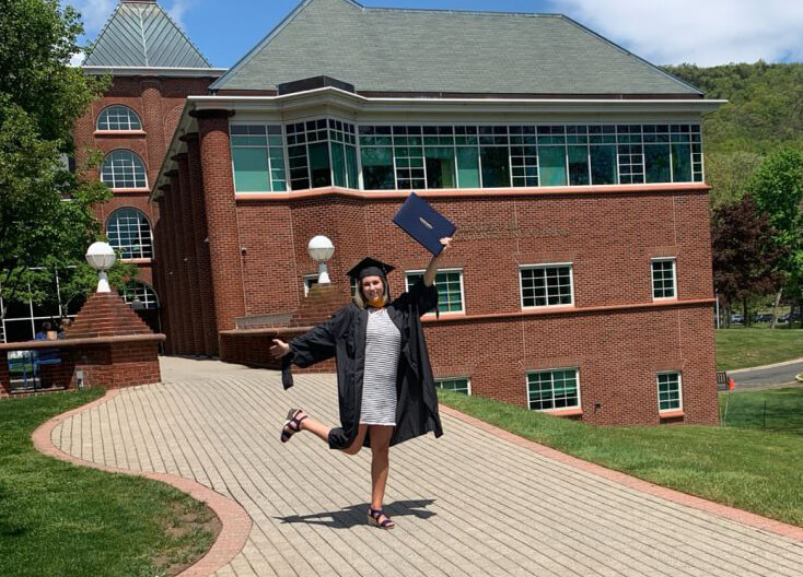 Katlyn Gallo poses with her diploma