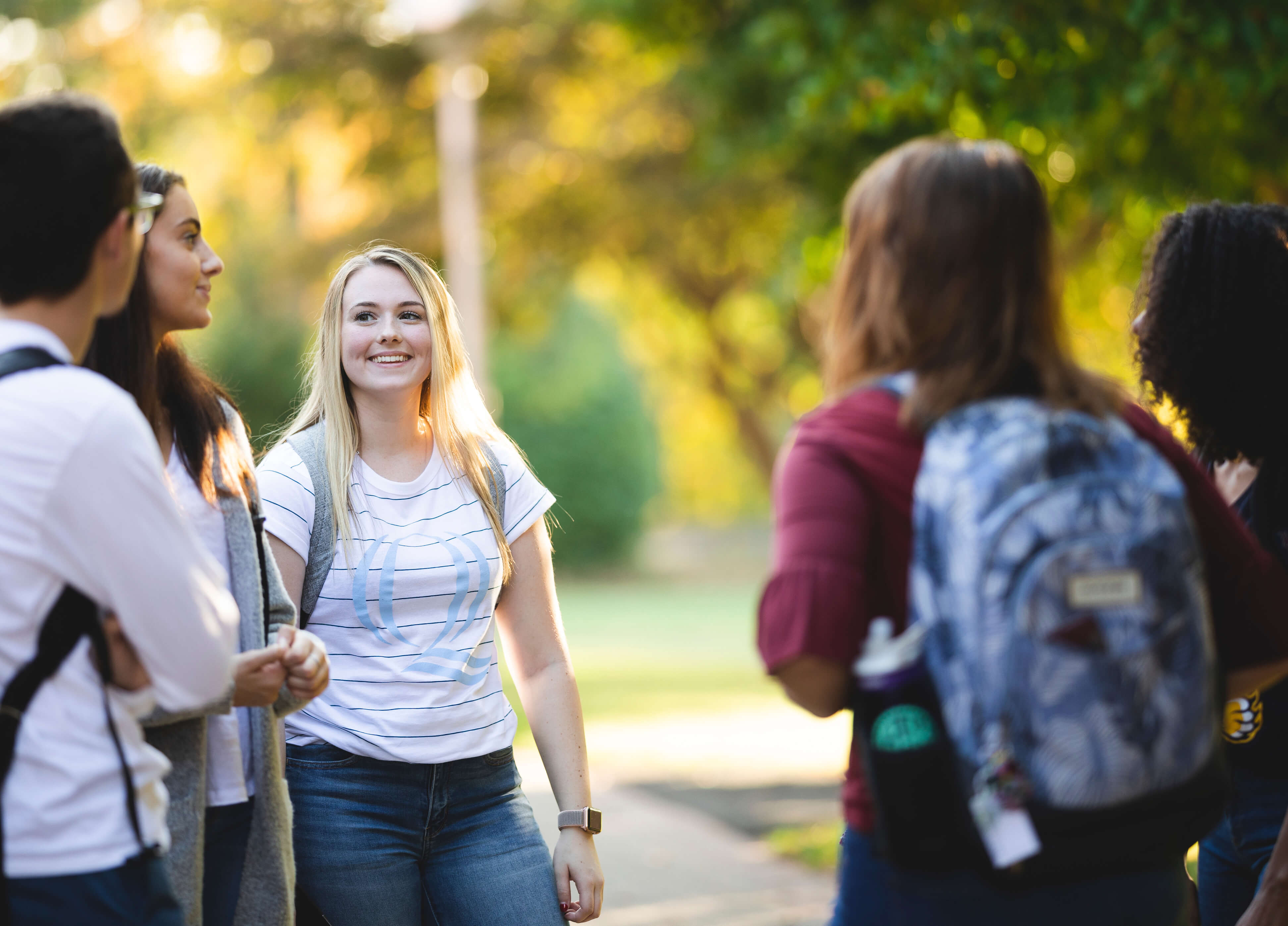 Students talk to each other on the Quad.