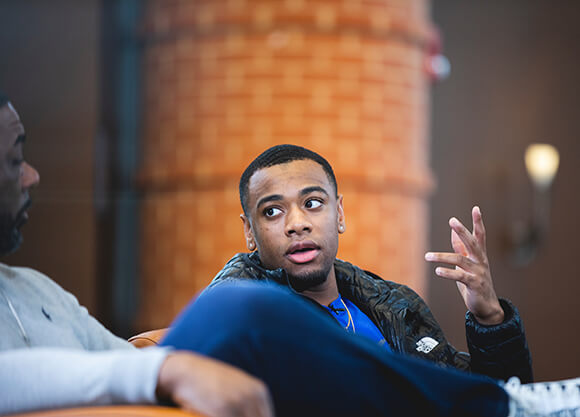 A student speaks in the Piazza.