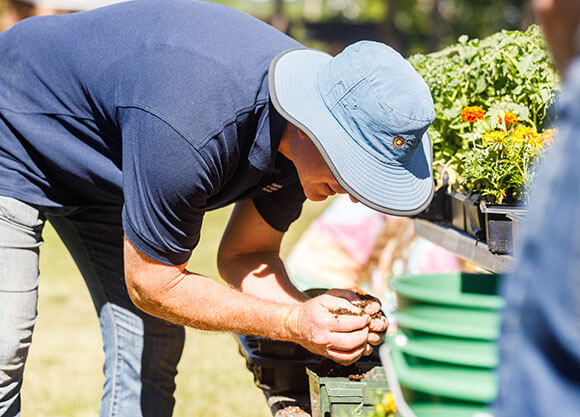 Sean Duffy planting a tree