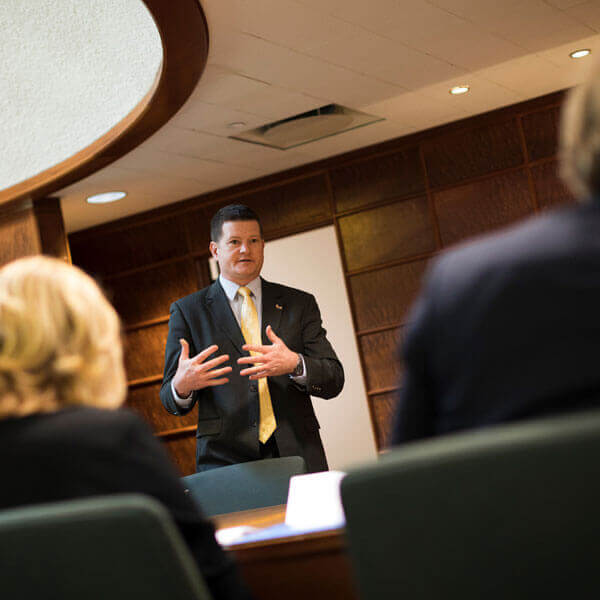 Chris Ball speaks to audience for the Central European Institute