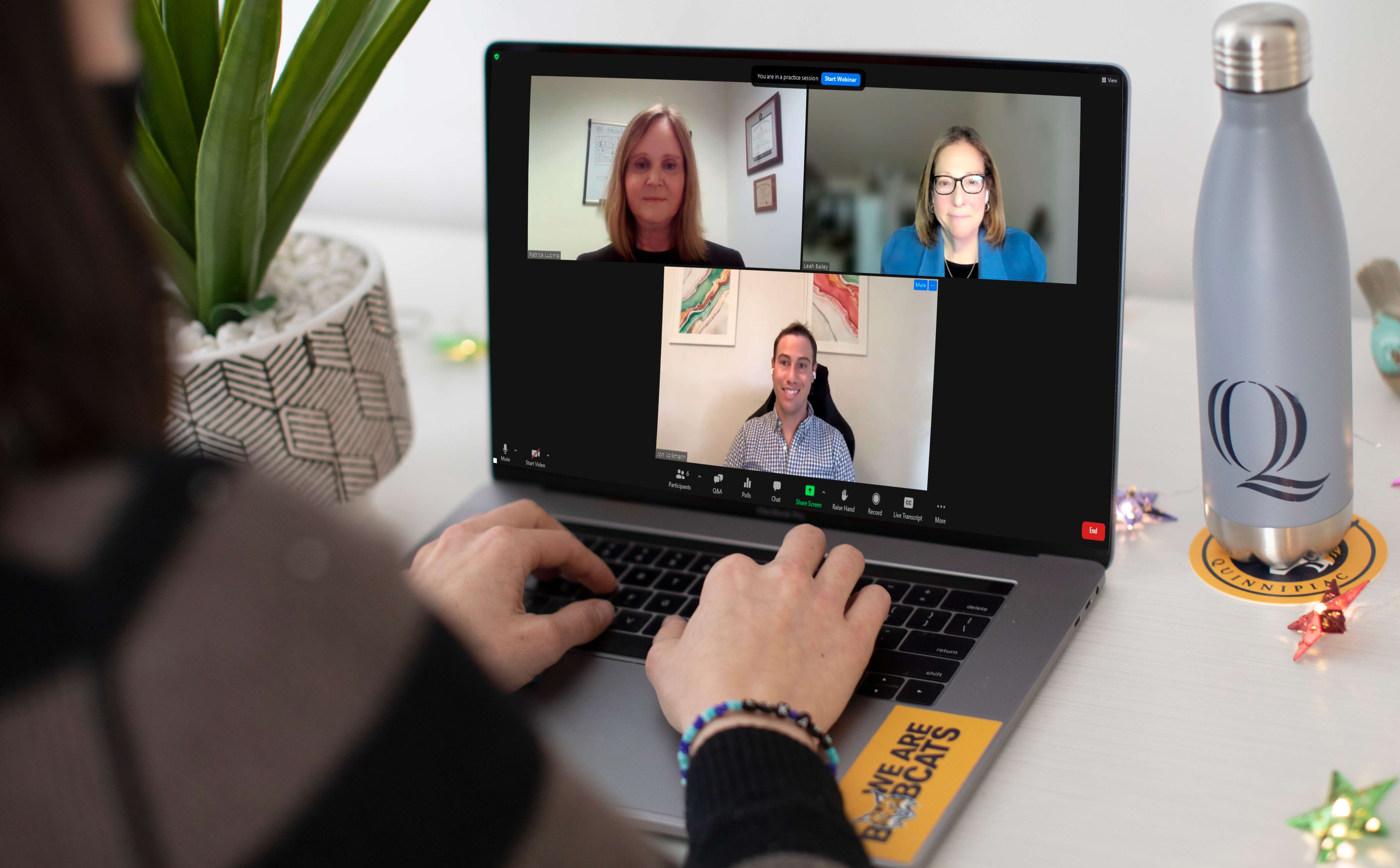 A computer with the virtual conversation during the Quinnipiac entrepreneurship speaker series.