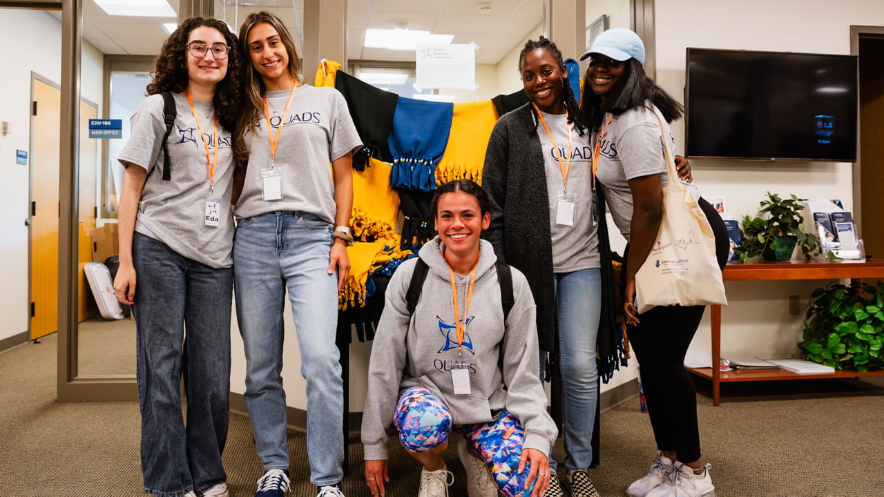 Student volunteers stand by a community project