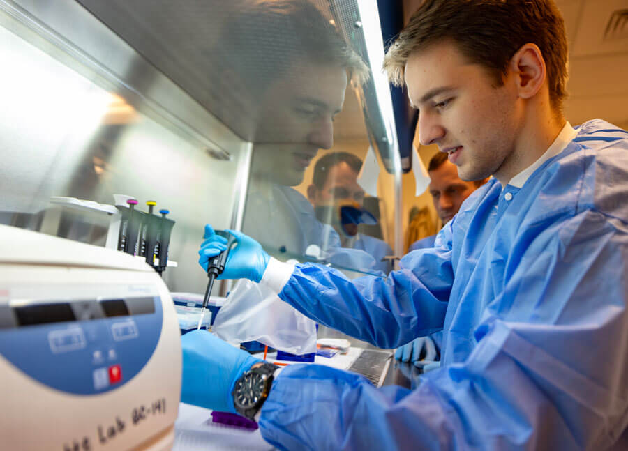 A student performs an analysis during a lab experiment.