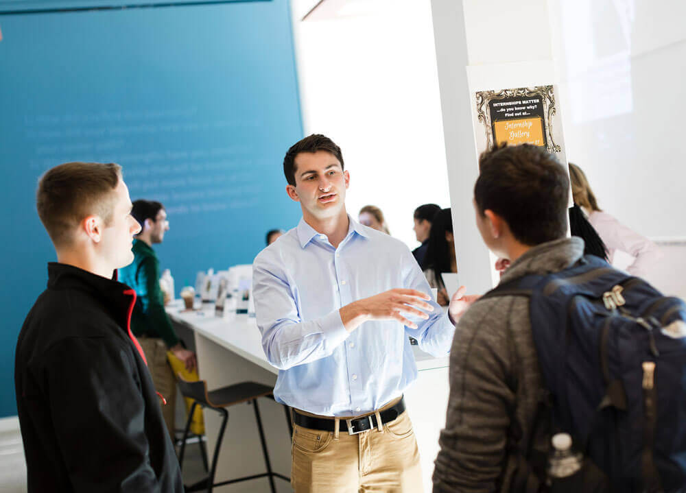 Students have a discussion in the Student Collaboration and Resource Center