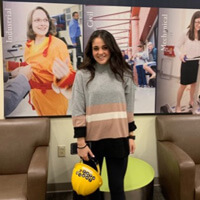 Samantha Scarpinella standing in front of an engineering sign