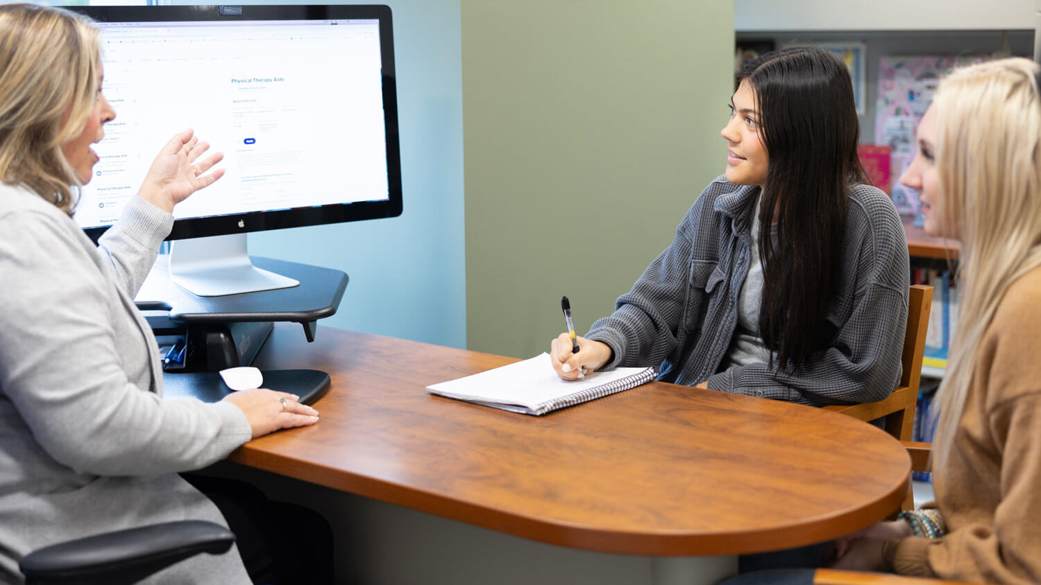 School of Health Sciences students discuss career options in an advising session.