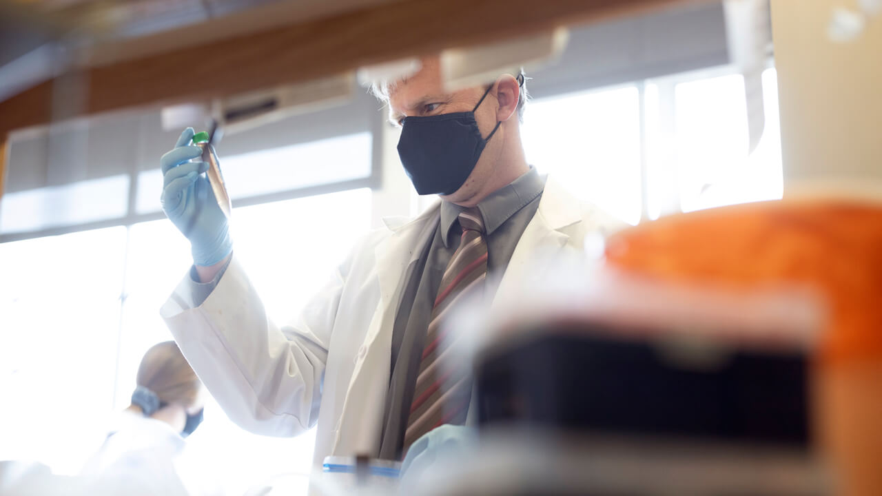 Professor working with a student lab partner.