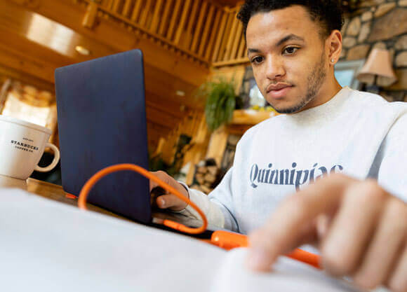 Student working on a laptop from home.