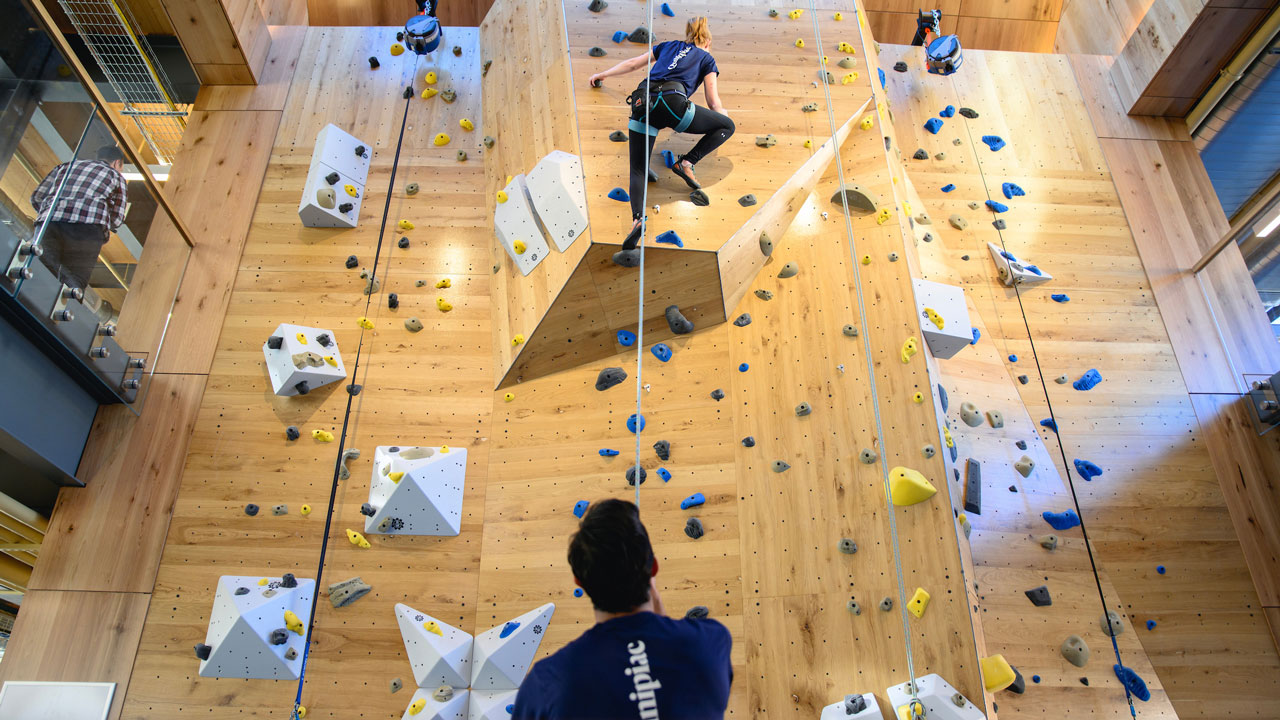 Girl climbing the rockwall