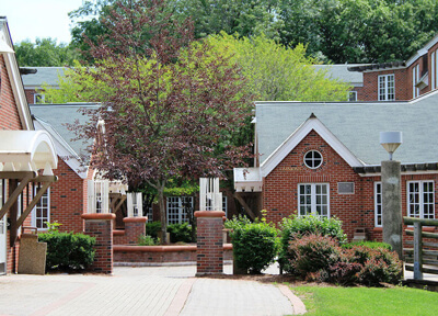 Exterior view of the Commons residence halls on a clear sunny day