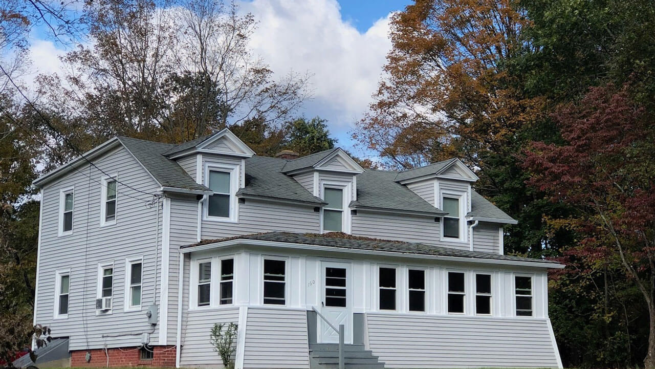 Two story grey house on 160 New Road