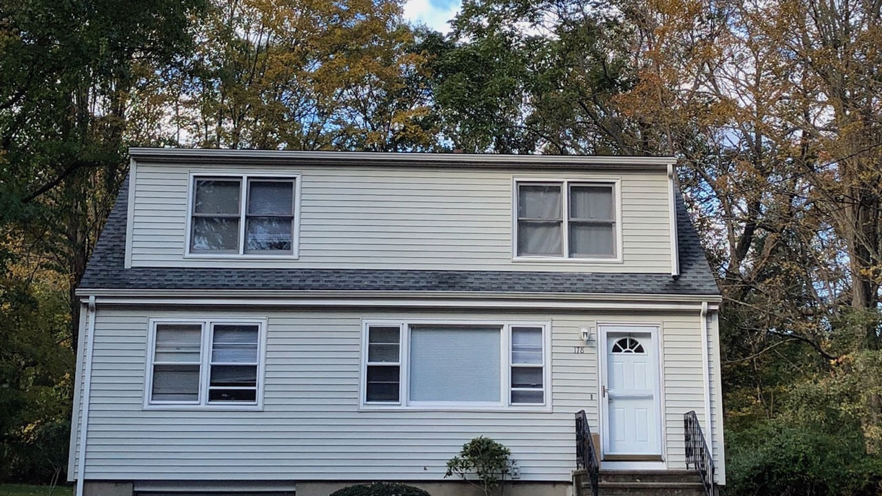 2 story house with nature in the background on 178 New Road