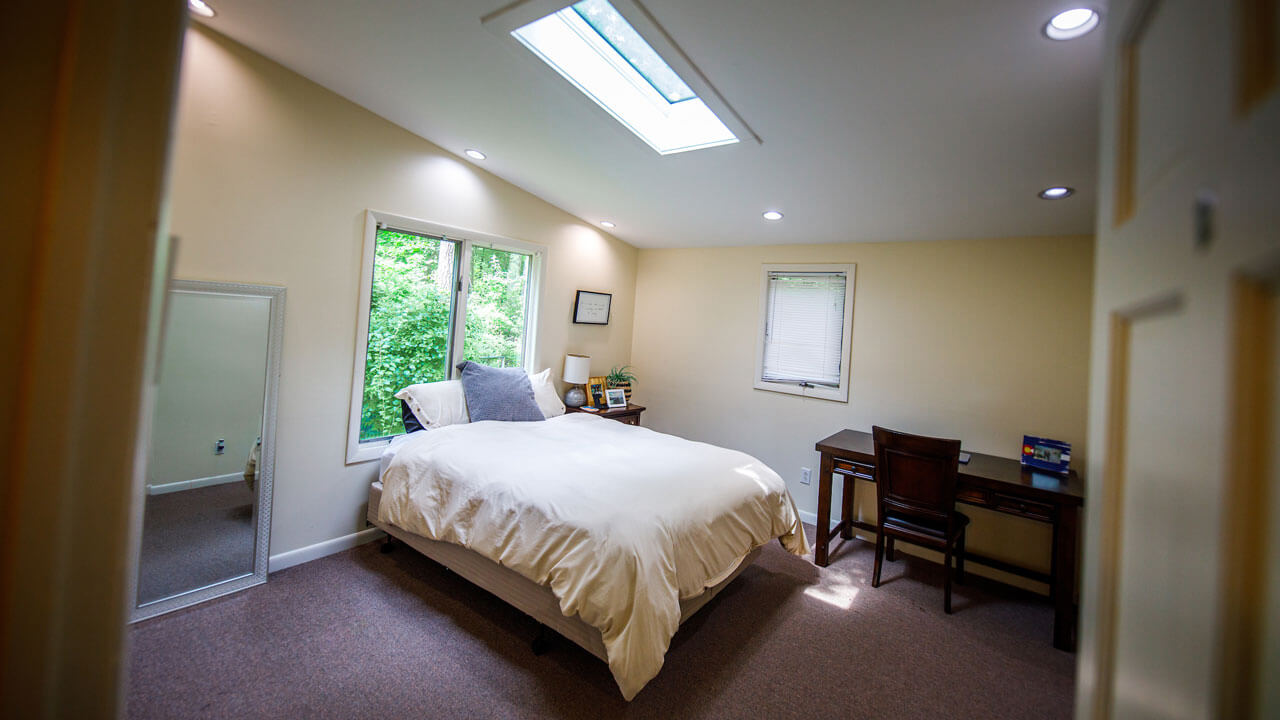 Airy bedroom with a queen sized bed