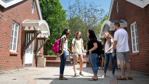 First year students talk outside their residence halls