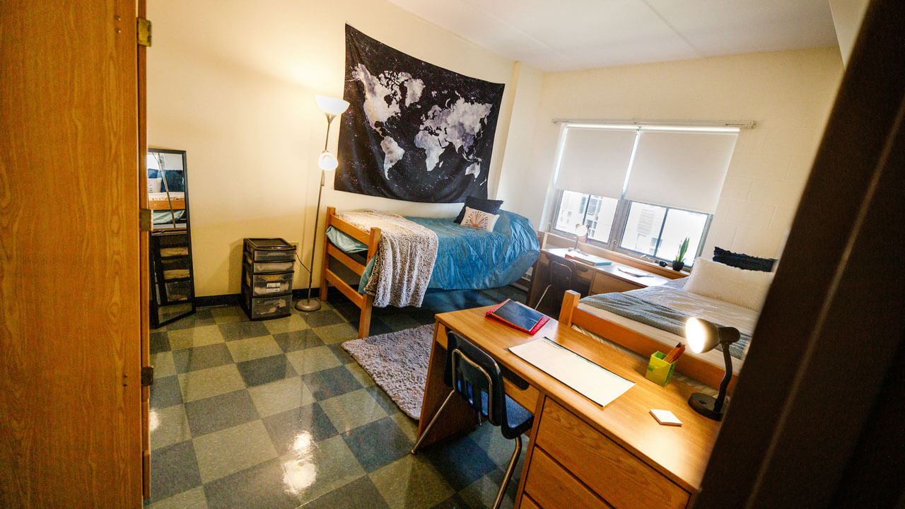 Double bedroom with 2 desks, 2 chairs, and 2 wardrobes